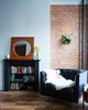 The key to making any space feel large is finding clever places for storage. In Dealtry and Barry's place, the architects designed bookshelves in old fireplaces. Photo of Modern Brooklyn Row House Renovation modern home