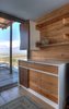 Modern home with Storage Room, Shelves Storage Type, and Cabinet Storage Type. The kitchen cabinets are custom-made from salvaged cypress. Photo of Kitchens with Killer Views