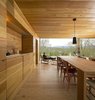 Modern home with Dining Room, Table, Chair, Pendant Lighting, and Light Hardwood Floor. A consistent wood palette makes the interior feel cohesive. Photo 5 of Refuge