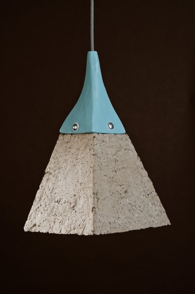 Pulpites Lamps

The Dear Human studio shares a building with a garment factory, so when the duo began playing with paper, there were plenty of cardboard dress forms and packaging material to use. Pulping, molding and shaping the geometric molds resembled creating with clay; they even dry the finished product in a computer-controlled industrial kiln.

Photo courtesy of Dear Human.