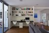 A clean, white palette is favored for the interior of the home. This minimal, “gallery-like” approach allows “changing daylight, art, furniture, and people to provide the color and motion,” says Klopf. Tanja similarly favors an all-white backdrop, relying on seasonally changing accent pieces like pillows, vases, or personal items to bring warmth and texture to the space. The home office nook in the family room offers a flexible workspace, and is accented by white Series 7 Arne Jacobsen chairs Photo of This Modern Addition in Northern California Has the Ultimate Rooftop Hangout modern home