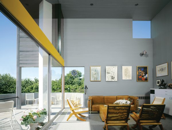 Inside, the slim cedar boards wrap the walls horizontally, a visual trick that seemingly expands the home’s petite footprint.