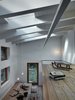 Modern home with Office, Light Hardwood Floor, and Study Room Type. As per the owner's request, the second floor’s open landing receives ample sunlight. The space is used as a study and the home's two bedrooms are situated to the right, their doors just outside the frame. Photo of A Stunning Alpine Home with Sweeping Views and Custom Crafted Interior