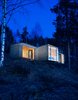 Modern home with Exterior, Cabin Building Type, House Building Type, Stone Siding Material, Flat RoofLine, and Glass Siding Material. The cabin’s exterior walls and roof are clad in overlapping stone plates that mimic the look of traditional wood paneling found in Western Norway. “It provides an affinity with the cabins nearby,” partner and architect Nils Ole Bae Brandtzæg explains. Solar panels cover the chimney pipe, lighting LED lamps inside. Photo of Cabin Norderhov