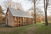 Modern home with Exterior, Wood Siding Material, Shingles Roof Material, House Building Type, Cabin Building Type, Glass Siding Material, and Gable RoofLine. Tiny houses are spreading across the world—and probably because it really just makes sense. The tiny home lifestyle is the ultimate application of creative resourcefulness, and allows residents to reduce their environmental footprints without sacrificing good design. Photo of Utrecht Cabin