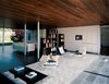 Modern home with Living Room, Chair, and Ceramic Tile Floor. The Mariscals' daughter, Olivia, whiles away the afternoon in the breezy living room. She sits on a sheepskin-covered Flag Halyard chair by Danish master Hans Wegner. Photo of 17 Modern Homes With Hans Wegner Furniture