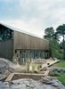 Modern home with Outdoor, Wood Patio, Porch, Deck, Back Yard, Large Patio, Porch, Deck, and Grass. On the wide deck, the family enjoys some peace and quiet. Photo of Sourcing Guide for Modern Prefab Companies in Europe