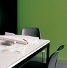 Modern home with Office and Desk. Van Everbroeck’s home office occupies the end of one arm of the building. Photo of 17 Stellar Uses of Color in Home Offices