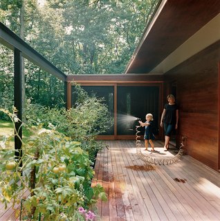 The main area opens onto the back deck for a seamless transition between house and surroundings.