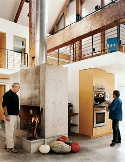 In keeping with the Goodmans' desire for just enough subdivision for rooms to sleep and work in, Cohen inserted a two-story volume into one of the barn frame's side aisles. An additional small mezzanine over the kitchen serves as a play area for the grandchildren.