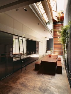 The cooking/dining space is the heart of the house, and is open to the elements.