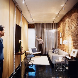 Milan Hughston's quiet street in Manhattan's West Village is moments from the neighborhood's boutique shopping and nocturnal ruckuses. Architect Joel Sanders made Hughston's space multi-functional; here it's shown as a living room, for relaxing or entertaining friends.