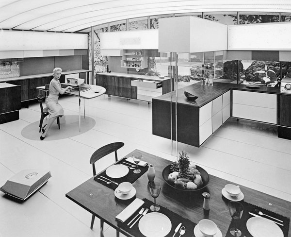 14 Feb 1959, Moscow, USSR --- Household chores in the future will be gone for the American housewife at the touch of a button or the wave of a hand.  A floor cleaner, (lower left) will scrub, mop, vacuum, wax or polish floors;  meals will be selected, cooked and served in seconds, all automatically, by remote control in the RCA Whirlpool Miracle Kitchen of the future.  A serving cart will walk to the table, load, scrape, wash, dry and store dishes.  The Miracle Kitchen will be displayed for six weeks, beginning July 4, 1959, at the American National Exhibition in Moscow.,  This is the first official U.S. Government display ever held in the Soviet Union. --- Image by � Bettmann/CORBIS