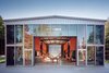 Modern home with Exterior, Glass Siding Material, Metal Siding Material, Metal Roof Material, and House Building Type. Adriance House by Adam Kalkin. Photo from Quik Build: Adam Kalkin's ABC of Container Architecture. Courtesy of Adam Kalkin. Photo of Q&A with Adam Kalkin