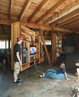 A media storage unit is made from a steel pivot welded to a heavy-duty tractor bearing by Sierra Metal Fabricators. The massive, smooth-spinning unit also serves as a room <br><br>divider, to screen a desk and computer station from the main living area.