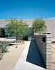 The DeBartolos wanted to keep the desert tradition of incorporating water near the entrance of the house as a sort of welcome mat, but they skipped the faux hacienda
fountain found throughout Arizona in favor of twin sheets of four-by-eight-foot steel plates that water pours over. Making the unusual fountain from standard-sized materials, which will weather naturally over the years, kept the cost down, too. Photo of Water Features We Love modern home
