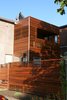The architect used horizontal slats for privacy, but alternated them on the fence and second-floor deck to allow sunlight and breezes through. Solar panels atop the roof heat the water; a green roof is in the process of growing in. The project was awarded Green Renovation of the Year and Best Housing Detail at the 2009 Ottawa Housing Design Awards. Photo of 30+ Best Modern Fences modern home