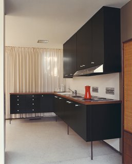 The lovely cornflower-blue kitchen cabinets in this Brooklyn, New York, home by Elizabeth Roberts Architecture & Design were professionally painted.