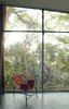 Modern home with Windows. Bo Bardi designed the Tripé, or Tripod, armchair, around 1948. Made of painted tubular metal and hand-stitched leather and possessing the same design principles as the hammock, several examples existed throughout the Glass House. Photo courtesy Espasso. Photo of Brazilian Design 101