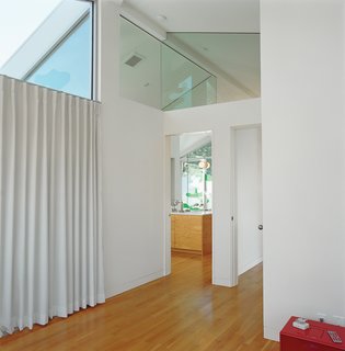 Clerestory windows, both interior and exterior, ensure that both privacy and daylighting needs are met in this residence.