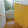Bestor gave each area of the house its own color scheme. The bright yellow stairwell maintains a cheery mood throughout. Photo of 40+ Yellow Modern Home Design Ideas modern home