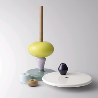 Is it a table or is it a game? It works well as both, as the old Nordic craft tradition of turning wood gets new life in the form of the Shuffle table. Like old painted wooden toys, this table is truly a mix-and-match stacking game. You choose where along the center wooden pole each of the bright shapes will go, and even determine the table height. The producers claim that this table has one function more important than all others – to create joy.