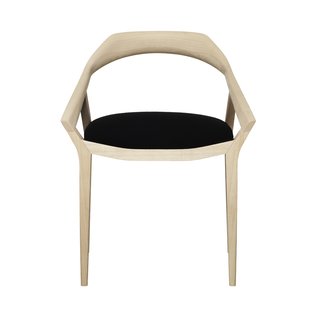 Swedese’s second chair to make the list is by Swedish designer Monica Förster, who has clearly been very busy, with many new pieces on display at the stands of different furniture and lamp makers this year. The Antelope chair was a favorite. Mirroring the curves of an antelope’s antlers that end in pointy spikes, the solid-ash wood of the back and armrests have a sculpted, organic quality. One piece of solid wood is bent ever so gently into shape to form the single, seamless arch around the back of the chair. This is one that really needs to be touched to be fully appreciated. And it would have felt right at home in Hans Wegner’s dining room.