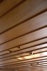 The cedar weatherboard ceiling in the living pavilion features triangular recesses for lightbulbs. Photo of Unique Ways to Design with Recessed Space modern home