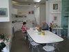 I had a nice chat, as well as a cup of coffee and a stellar shortbread biscuit, with Ruth McCabe (left) of Maggie's Center. The main space of the center, and the one to which many visitors gravitate, is what is ostensibly the dining room. "There's a warmth and comfort about it," McCabe said of the building. "It's a lovely place to work in. You feel like you're at home." I'd easily say the same of Ruth, who is easily the sweetest person I've yet met on this tour. The other gentleman in the photo, Andrew, has been coming to the Center for a while. He's also confident about a Lib-Dem and Torie alliance. Photo of Maggie's Center by Zaha Hadid modern home