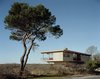 Modern home with Exterior. The cottage appears to hover over Shelter Island, cantilevered on all sides on top of a foundation of spread concrete footings above a slight, rolling berm on three-quarters of an acre. Courtesy Architects and Artisans. Photo 2 of Shelter Island Retreat