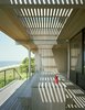 Modern home with Outdoor, Large Patio, Porch, Deck, and Wood Patio, Porch, Deck. The exterior is clad in 100-year-old cypress meticulously crafted for the home by former shipbuilder George Velmachos of Wright and Company. Courtesy Architects and Artisans. Photo 5 of Shelter Island Retreat