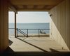 Looking out to the water, the view peers back to Long Island with the Left Fork on its right, and the Right Fork just opposite. “It’s like a huge harbor with its outstretched arms around you,” Tamarkin says. Courtesy Architects and Artisans. Photo 6 of Shelter Island Retreat modern home