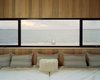 Modern home with Living Room and Bench. Shelter Island is two-and-a-half hours from New York City, and is accessible only by a seven-minute ferry ride – just enough, Cary says, “to free you from the bonds of the city.” Courtesy Architects and Artisans. Photo 10 of Shelter Island Retreat