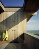 Modern home with Outdoor. Reclaimed and recycled cypress beams measure 16 inches tall, six inches wide and are 36 feet long. Courtesy Architects and Artisans. Photo 12 of Shelter Island Retreat