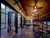 Panton placed several custom-made queen-size steel-and-wood bunk beds inside the bunkroom. All the beds are on wheels and fit through the double-side door openings, so they can be easily rolled into the porch for sleeping. Complementing the locally milled, insect-resistant cedar bunkroom ceiling are floors of purple-stained white oak (bunkroom) and the especially durable Brazilian Tigerwood (screen porch). Photo 11 of Texas Bunkhouse modern home