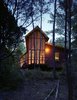 Modern home with Exterior, House, Cabin Building Type, Wood Siding Material, Glass Siding Material, Shed RoofLine, and Gable RoofLine. “I wanted more of a skeletal look for this house, and less of a chunky, log-cabin look,” says Panton, who added stark steel bracing across the entire length of the porch’s roof structure. Photo 14 of Texas Bunkhouse