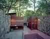 With its Brazilian Tigerwood enclosures, the outdoor bathhouse, which includes showers, sinks and dressing areas, references the nearby bunkhouse. Photo 17 of Texas Bunkhouse modern home