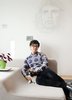 A wall sketch of Che Guevara is a focal point in architectural theorist and installation artist An Te Liu's living room. Photo of Canada's Design Domestic modern home