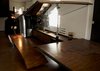 The ramp extends upward to reveal a full kitchen and dining area. Photo of Canada's Design Domestic modern home