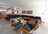 In Kohn's living room are classic mid-century pieces and a DIY coffee table made from a ping pong table and boxes. Photo of Canada's Design Domestic modern home