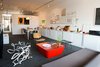 Micah Lexier proudly displays his collection of objects along a display shelf that runs the length of the room. Photo of Canada's Design Domestic modern home