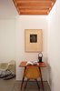 Modern home with Office, Chair, and Desk. One of Orlovskiâs collages hangs in the third bedroom/office, which is lit naturally from above and furnished with mid-century pieces. âI knew their new house would look great when I saw how they furnished their old house,â says Oreck. âStas loves finding this stuff on eBay or Craigslistâitâs a labor of love.â Photo of 17 Stellar Uses of Color in Home Offices