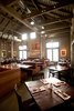 The dining room is dominated by large tables and booths meant to emulate a farmhouse aesthetic. The designers looked locally and found lounge tables at Roost in Sausalito; communal tables and dining table tops from reclaimed-wood furniture-maker The Wooden Duck in Berkeley; and dining table bases, booths, and banquettes at West Coast Industries in San Francisco. Photo of Farmstead Restaurant modern home