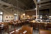 Fostering the spirit of community, Farmstead hosts community-table meals several times each month, with menus ranging from fish fries to plates of "Pig Pickin'." The guests sit on "simple schoolhouse chairs," Johanson says, sourced from Falcon in St. Louis, Missouri. Photo of Farmstead Restaurant modern home