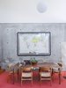 Modern home with Dining Room, Table, Chair, Pendant Lighting, and Floor Lighting. A monumental German climate map enlivens the dining area, which also sports CH 23 & CH 30 chairs by Hans Wegner. Photo of 17 Modern Homes With Hans Wegner Furniture