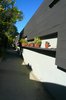 The front gate was closed but we entered anyway. Bestor is a big fan of the plant wall along the main walkway, which ties the various front entrances together and lends some visual detail to an otherwise simple form. Photo of An Architect's Guide to Silver Lake modern home