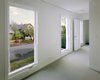 Natural light and fresh air pours in through the six windows (each three feet wide by six-and-a-half feet tall) that pattern both sides of the home. “We picked out this size because it’s the biggest you could buy and still be standard,” says Boardman, mindful that custom windows cost a whole lot more. Photo: Sally Schoolmaster. Photo 8 of Portland's Cape Cod Remodel modern home