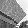 Modern home with Exterior, Wood Siding Material, Cabin Building Type, and Butterfly RoofLine. "The location allowed the development of several effluvial sensations," Poss says. "Throughout the day water reflections are projected onto the soffit." Photo by Phillip Kalantzis-Cope. Photo of Butterfly Roof Meditation Hut