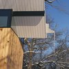 Modern home with Exterior, Wood Siding Material, Cabin Building Type, and Butterfly RoofLine. The V-shape roof, which dominates the structure's silhouette, channels rainwater to a central spout then into the pond—for most of the year. Photo by Phillip Kalantzis-Cope. Photo of Butterfly Roof Meditation Hut