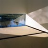 Modern home with Windows. The low, horizontal window in the main space "frames a meditative fragment of water," Poss describes. Photo by Phillip Kalantzis-Cope. Photo of Butterfly Roof Meditation Hut